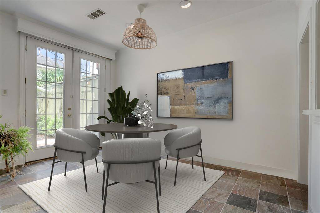Living Room - A gas log fireplace anchors the space with windows overlooking the back yard.