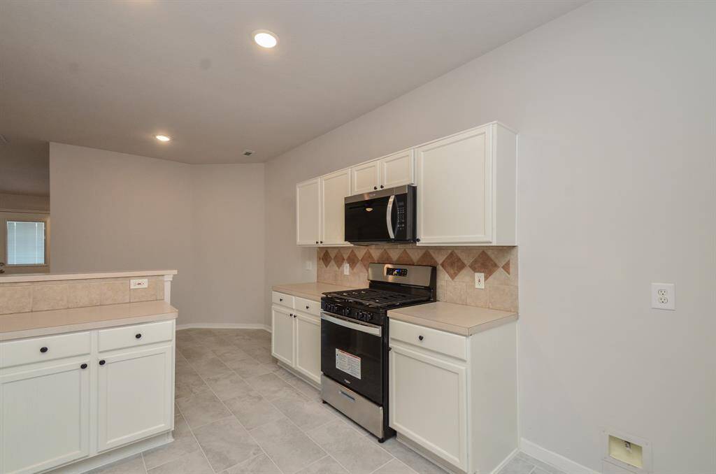 Freshly painted cabinetry throughout the house