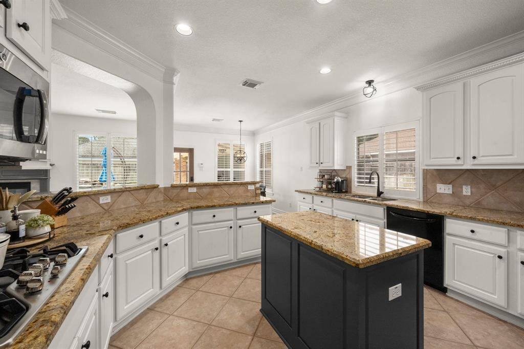 Kitchen opens easily into the family and breakfast areas, great for entertaining.