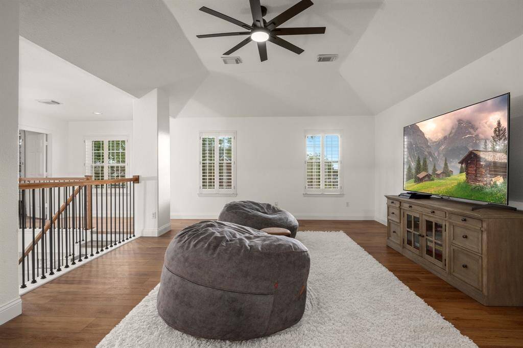 Upstairs gameroom with vinyl flooring for easy cleaning and durability.