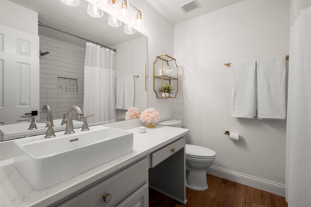 Secondary baths have been updated with new flooring, sinks, and fixtures!