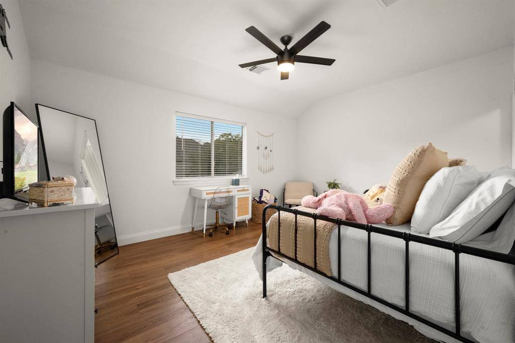 All the secondary bedrooms have new ceiling fans, fresh paint, and vinyl plank flooring.
