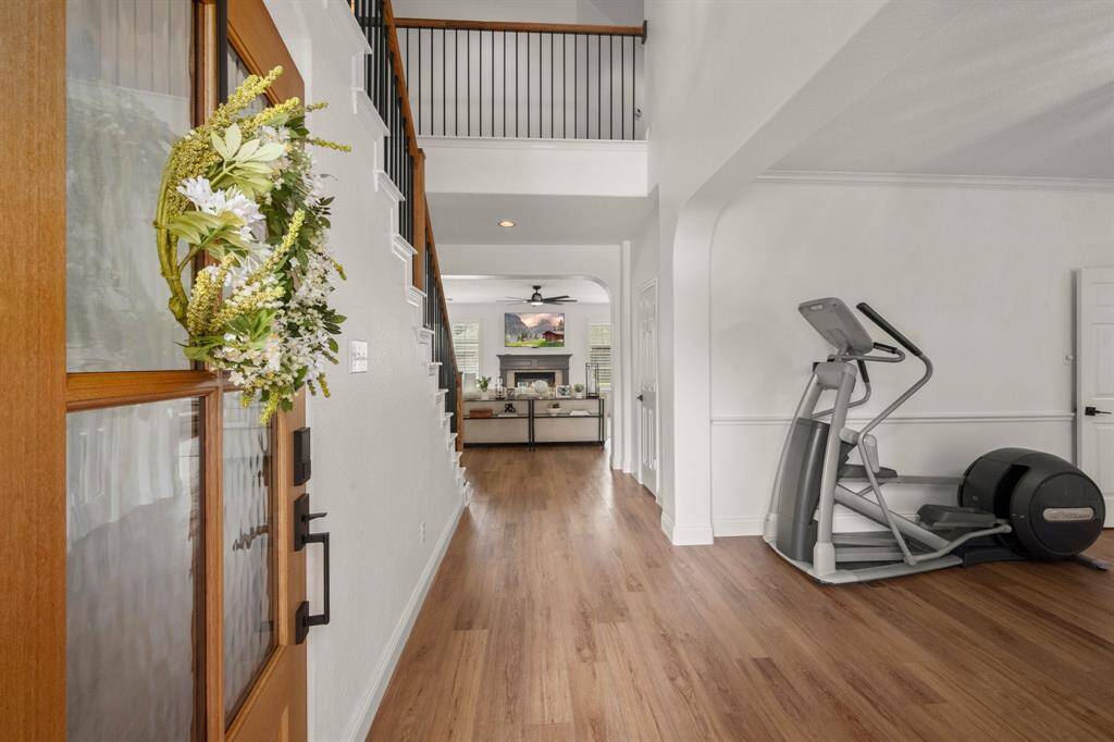New vinyl plank flooring stretches throughout the living and dining spaces.