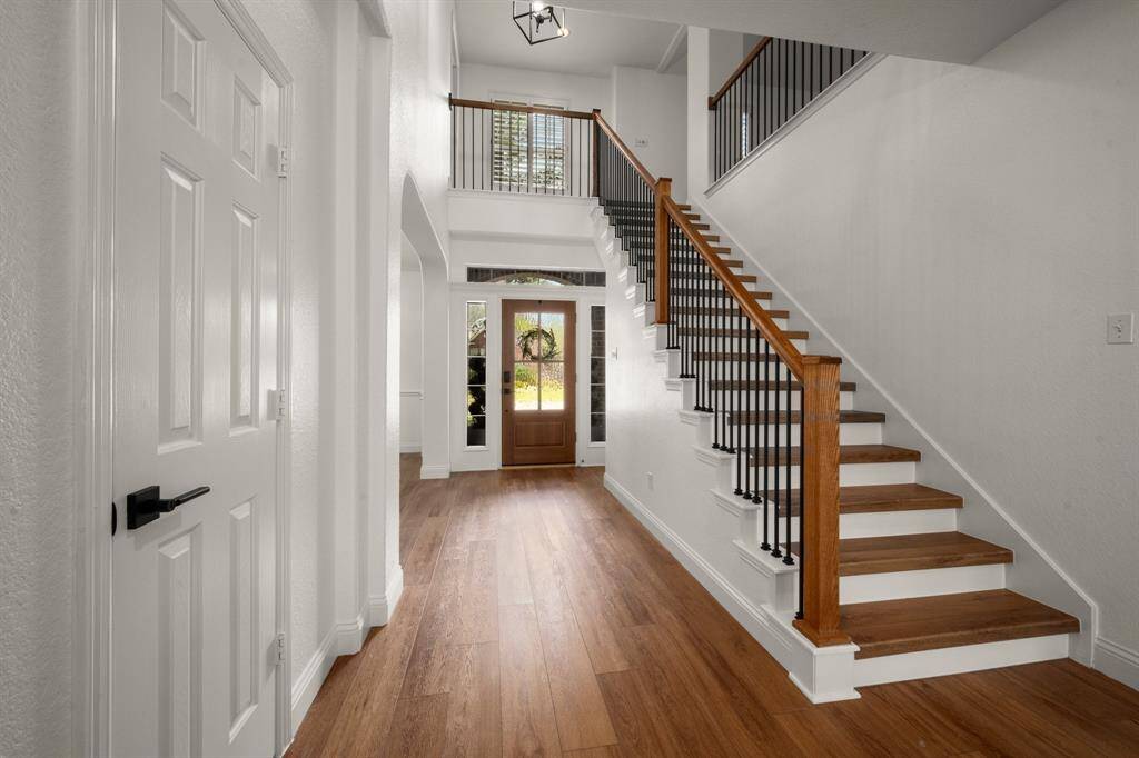 New balusters, railing and stair treads balance traditional styling with modern elegance
