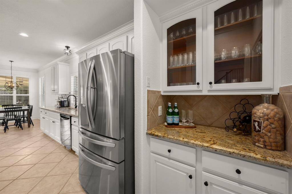 Butlers pantry between dining and kitchen is perfect for a coffee or wine bar.