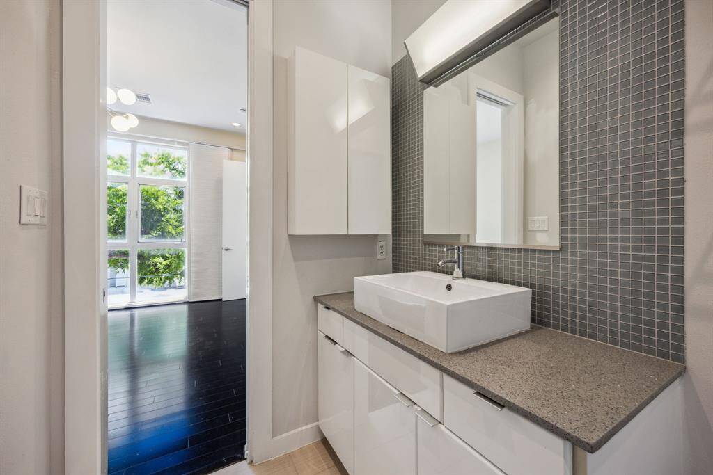 The primary bathroom features modern finishes in every corner.