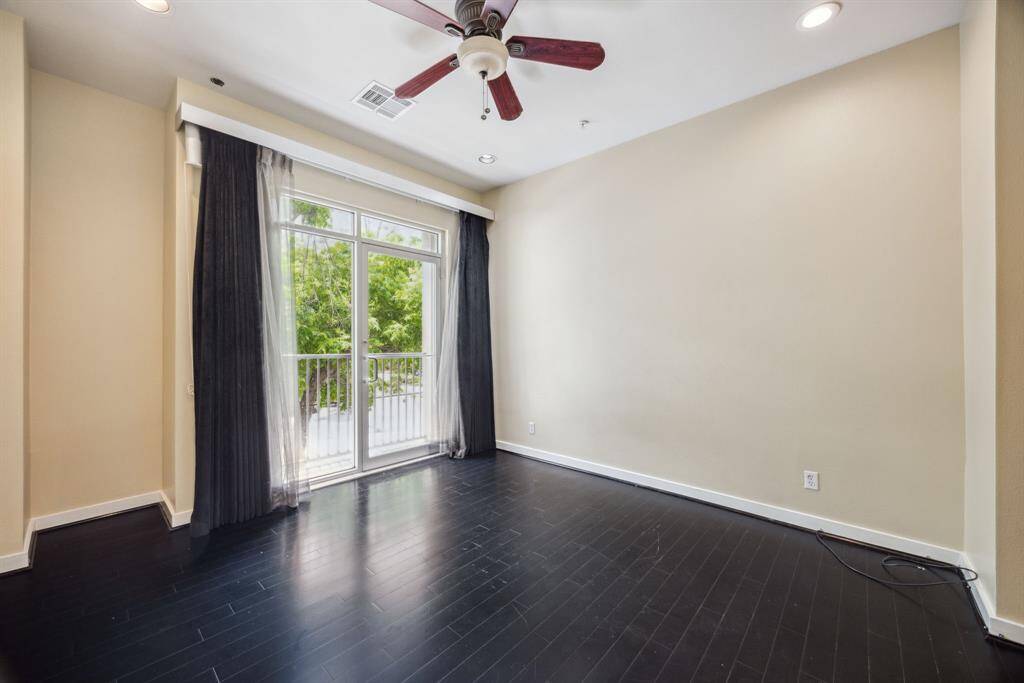 Floor to ceiling windows, high ceilings, and recessed lighting throughout.