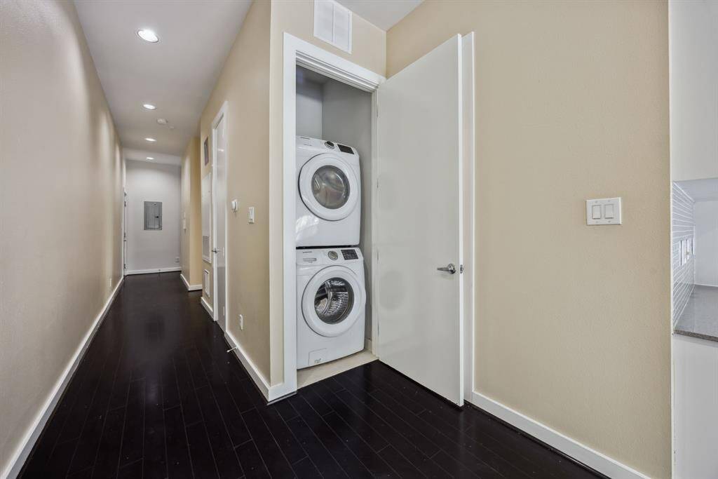 In-unit stacked washer and dryer for your convenience.