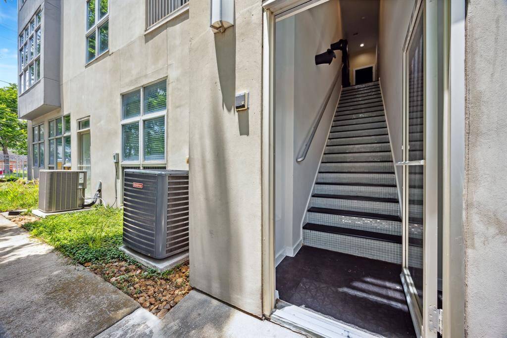 Private stairwell entrance with a modern exterior design leading to the pedestrian gate onto Pierce St.