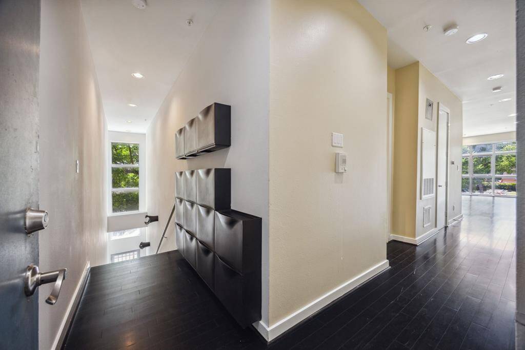 Another view of both of the main entrances. Built in shoe storage for your convenience.