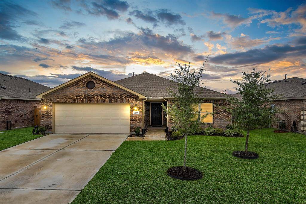 Charming single-story home with a well-maintained brick facade, 4 beds and 2 baths two-car garage, and a welcoming front yard, in the amenity filled Harrington Trails