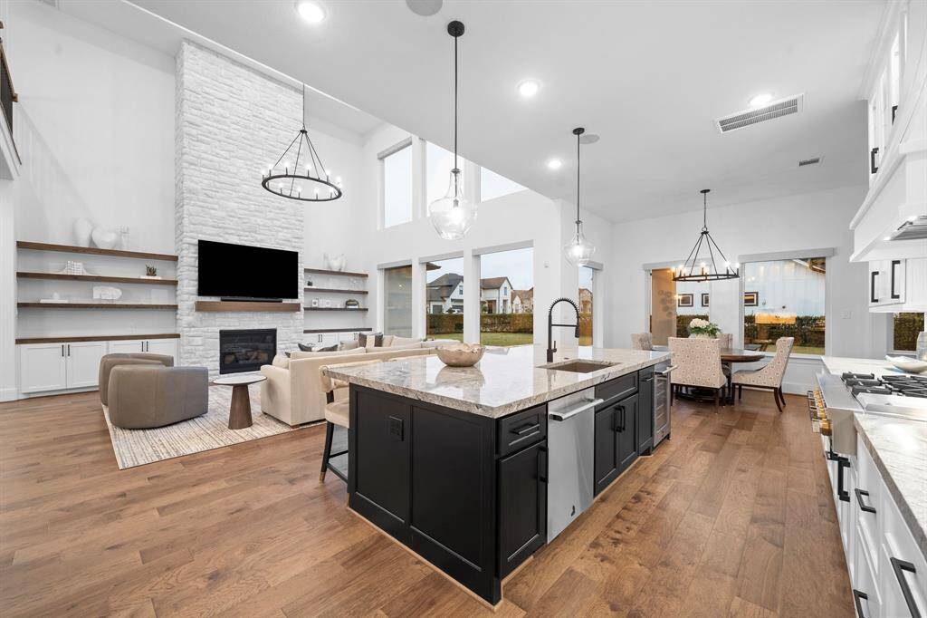 From the island, the kitchen opens fluidly into the living area, showcasing how this space was designed for daily ease and entertaining alike.