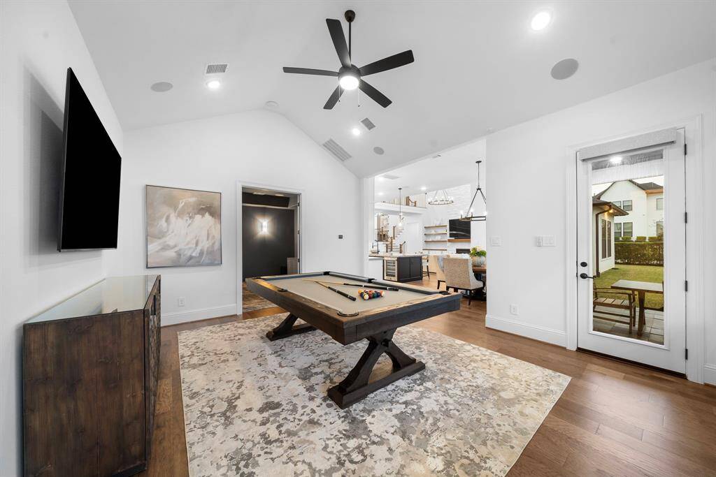 Just off the kitchen and breakfast area, this flex space easily transitions between a relaxed lounge zone and a lively entertainment hub, ideal for casual gatherings or game nights.