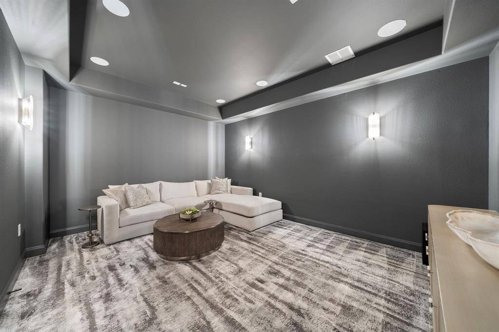 Reimagined to elevate the cinematic experience, the room includes in-ceiling speakers, fresh paint, and dimmable lighting—creating a dedicated setting for elevated entertainment at home.