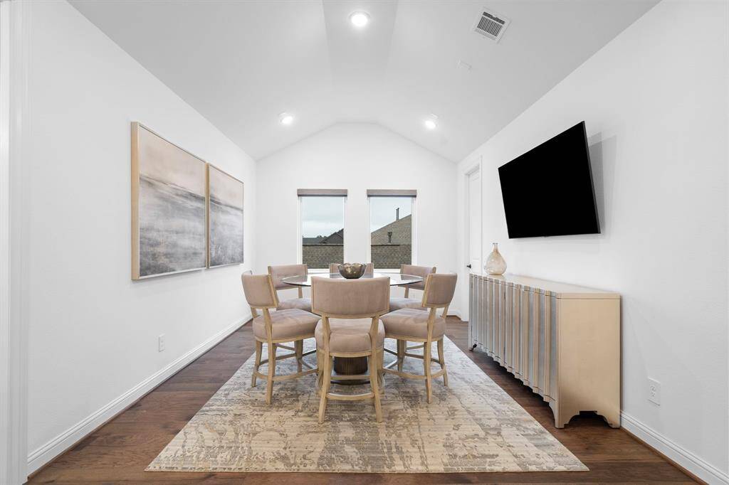 Tucked just beyond the landing, this versatile flex room is ideal as a media lounge, game area, or reading nook, with ample light and space to suit your needs.