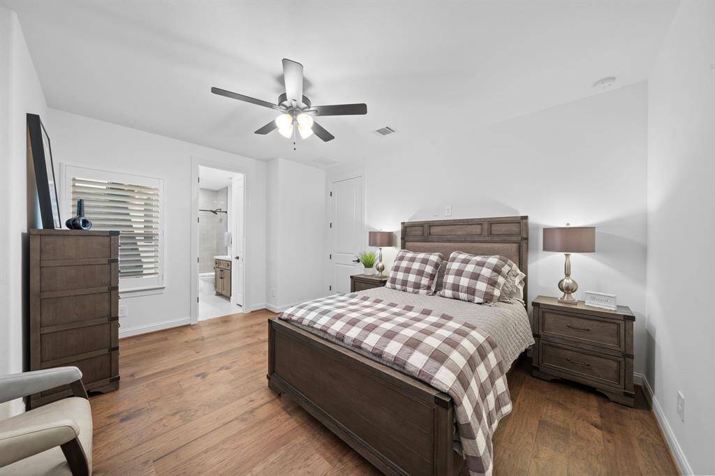 Ensuite access and streamlined furnishings make this guest space effortlessly comfortable and functional.