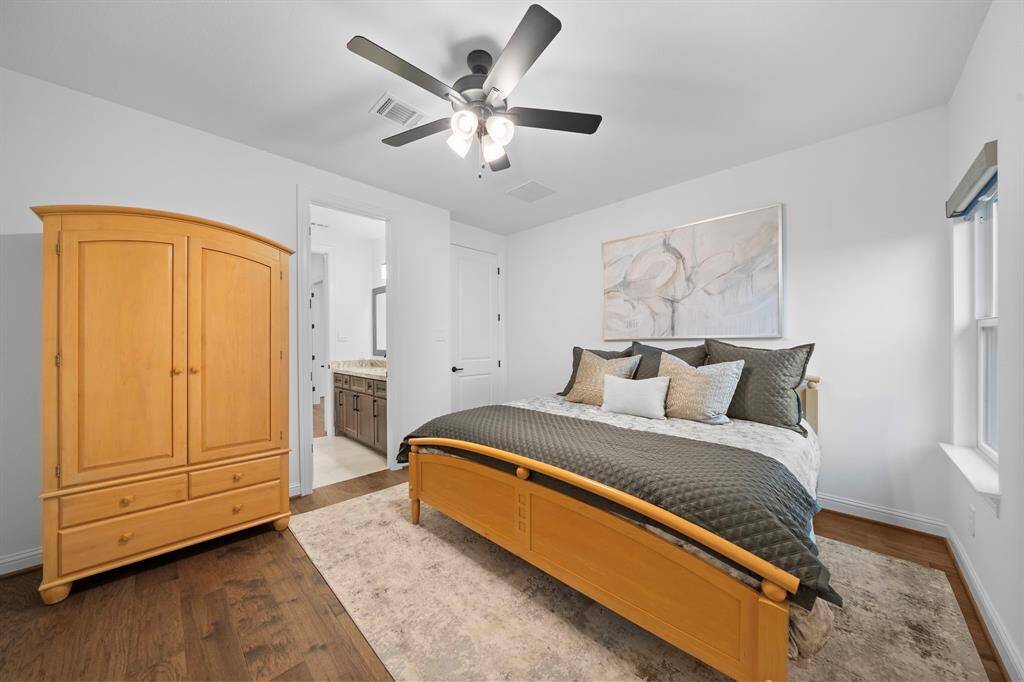 Designed with comfort and function in mind, this secondary suite includes hardwood flooring, dual window exposures, and direct ensuite access.