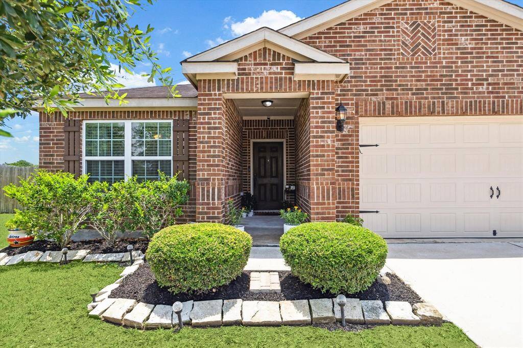 CHARMING BRICK EXTERIOR AND WELL MAINTAINED LANDSCAPING PROVIDE EXCELLENT CURB APPEAL!