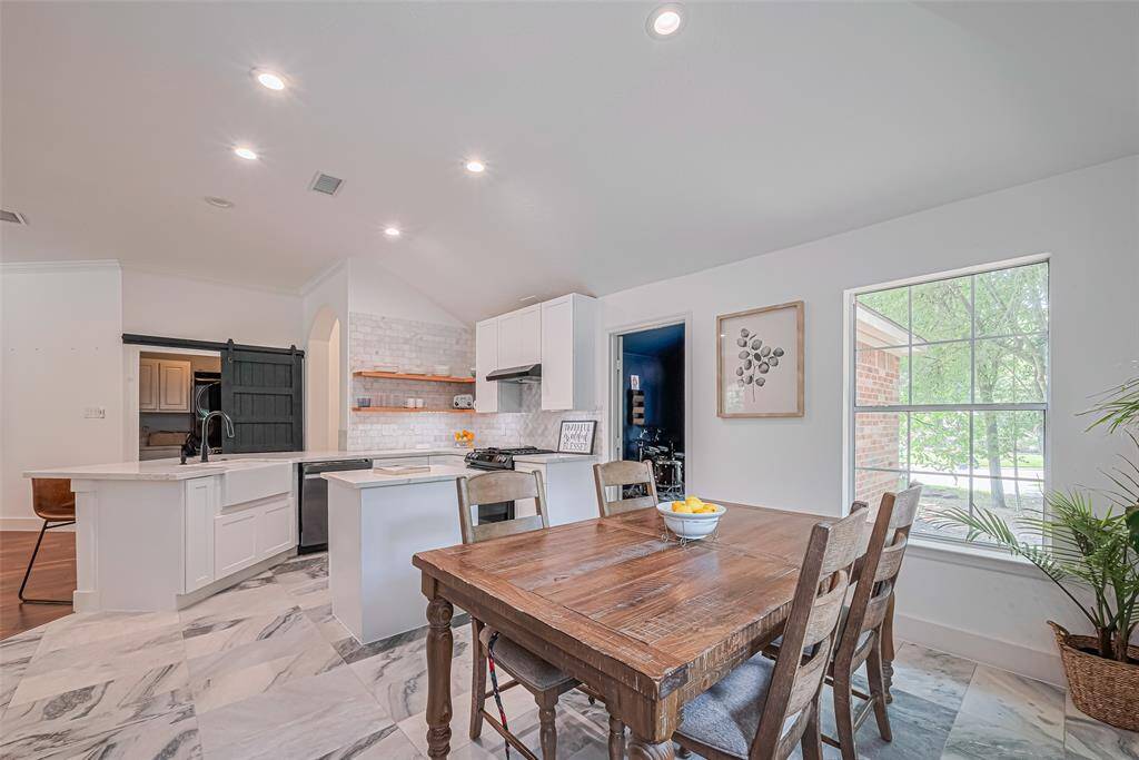 This kitchen has 2 large windows providing lots of natural light