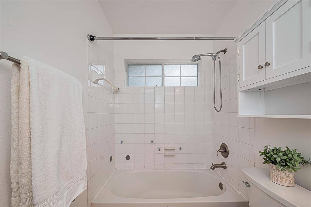 A closer look at the Shower/tub combination and a window for additional light