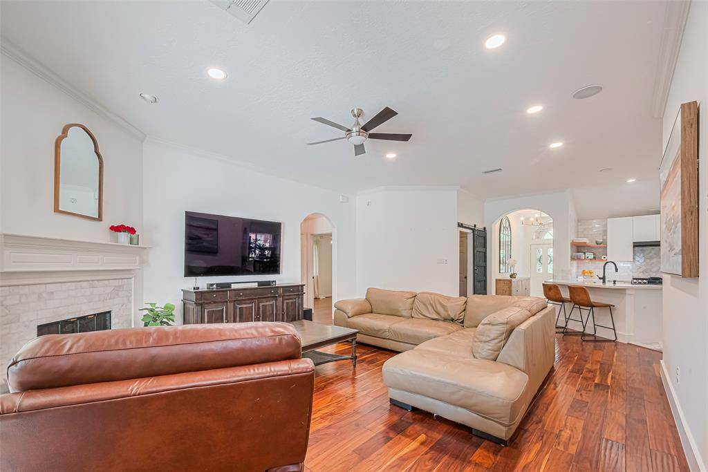 From the back door, you can see how the Den opens to the newly renovated kitchen in this open concept home.
