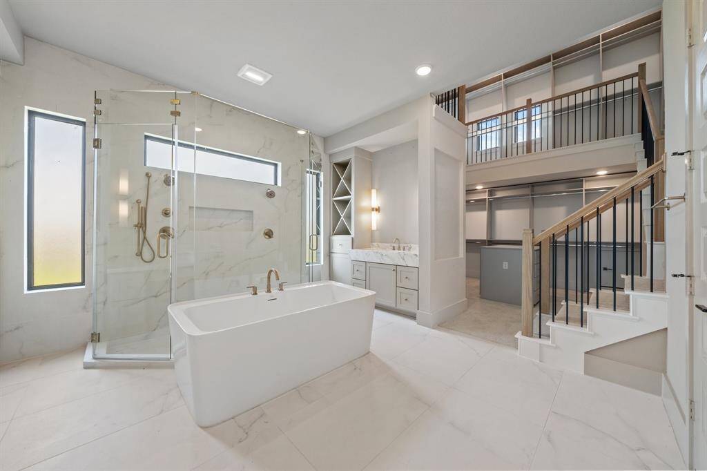 Showstopping two-story closet, an impressive space designed for maximum storage and style.