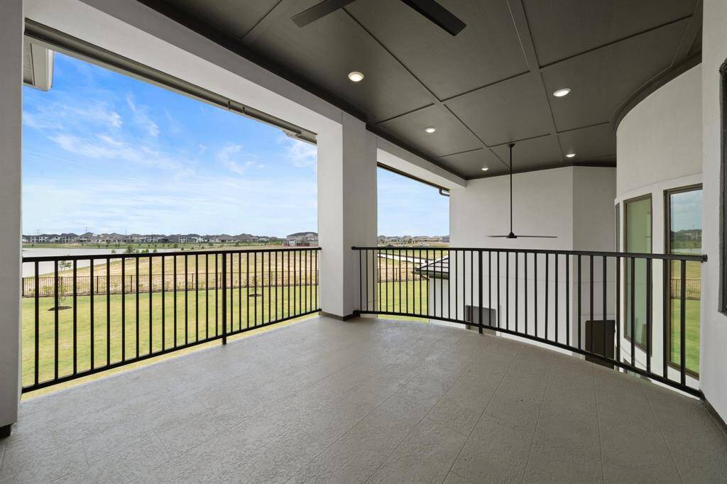Enjoy the view from the upstairs covered balcony.