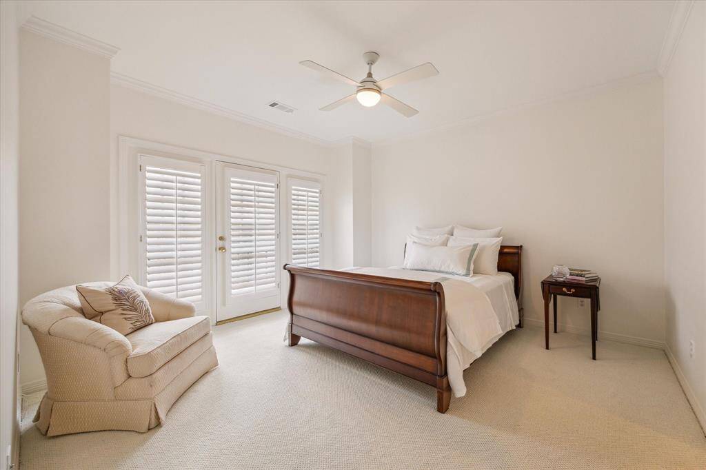 Bedroom - There are two secondary bedrooms adjoined by a Hollywood bath on the second floor. Both have walk-in closets, crown molding and shutters.