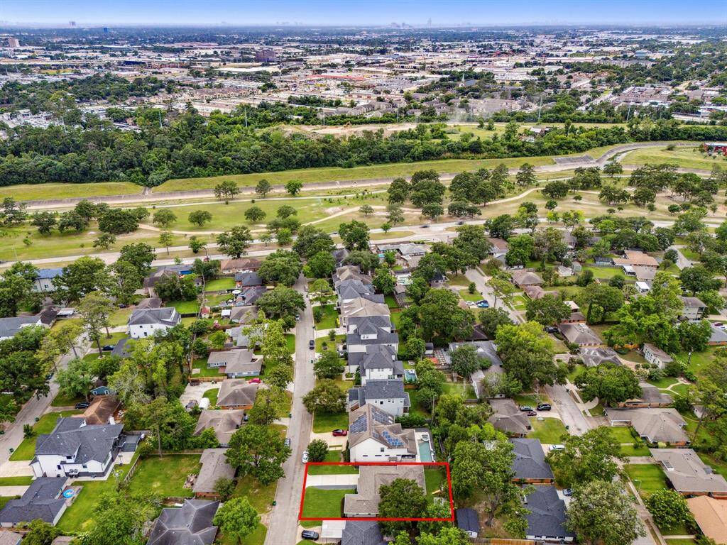 Ariel view of home in reference to the neighborhood and TC Jester Park
