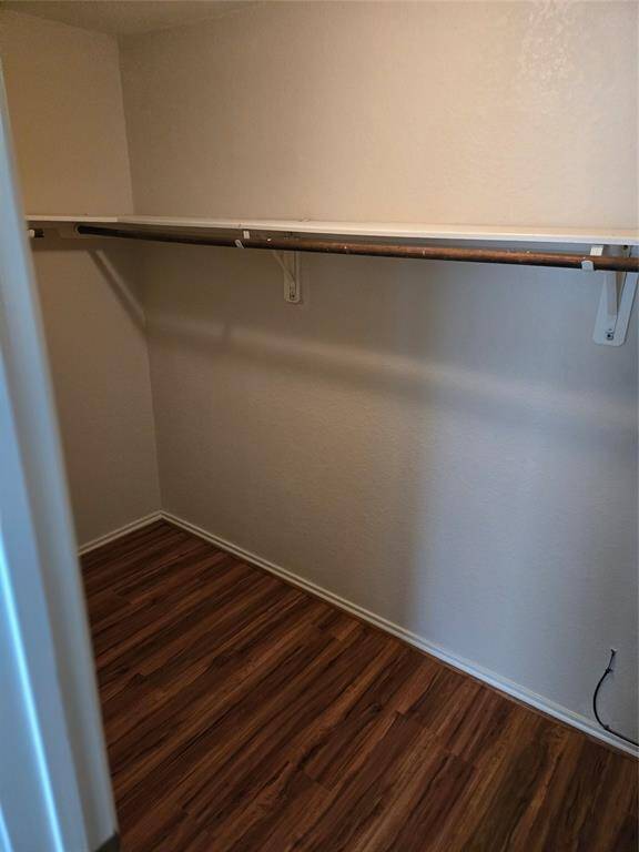 Primary bedroom walk in closet