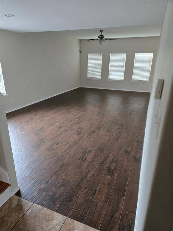 Wood tiled open living room and dining room