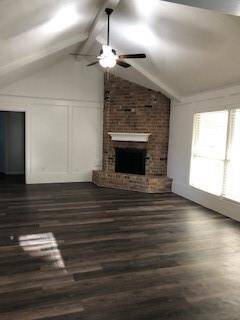 Living room with beautiful brick fireplace