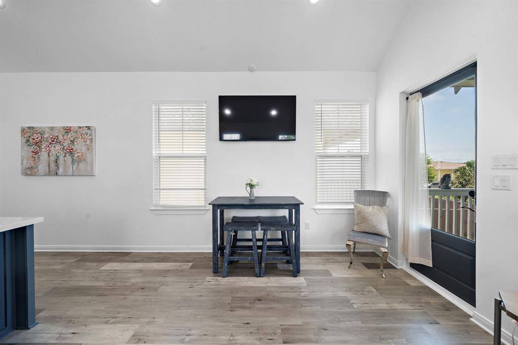 Open concept dining area with smart tv