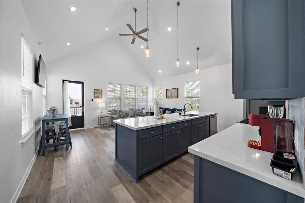 High ceilings and open concept make this generous floor plan light and bright