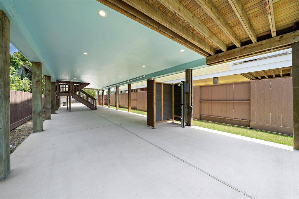 Oversized parking/carport underneath the house. Double wide concrete driveway