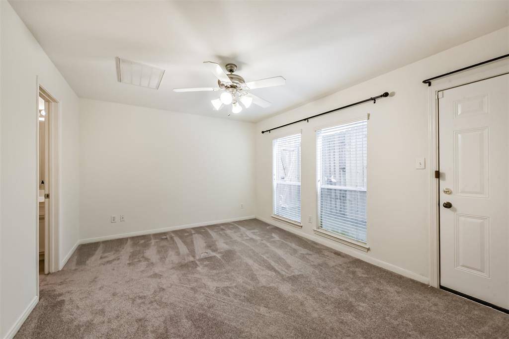 Downstairs bedroom with attached full bath