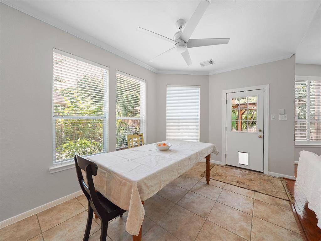 Imagine starting your day in the bright and airy breakfast room, conveniently situated just off the kitchen and living room. This seamless flow creates a welcoming and functional space, perfect for enjoying morning coffee and planning your day.