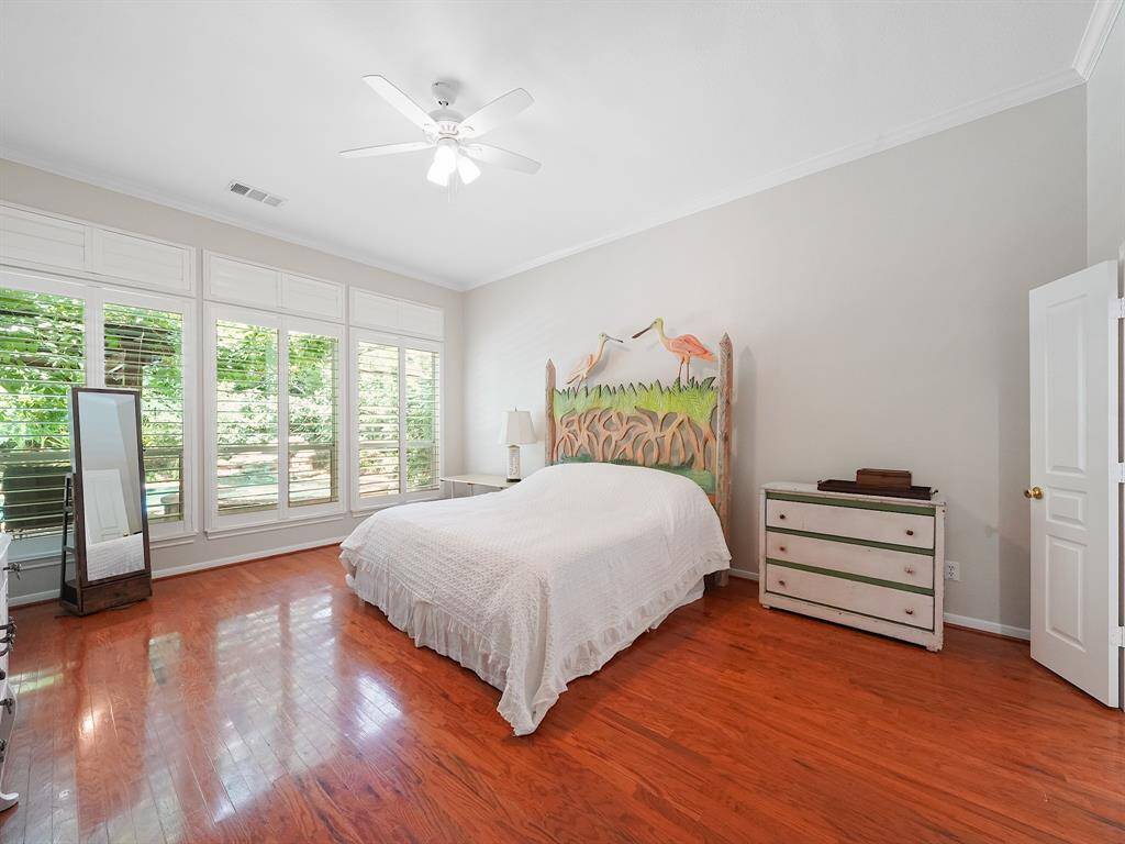 Indulge in the comfort and charm of this beautiful primary retreat. Featuring warm wood flooring, a sun-drenched bay window with plantation shutters, and a beautifully updated ensuite bathroom, this space offers the perfect blend of style and functionality. Unwind and recharge in your own private sanctuary.