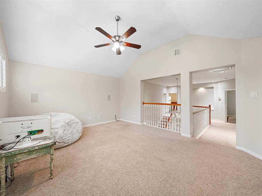 The expansive upstairs game room provides versatile space, ready to adapt to your unique needs and lifestyle.
