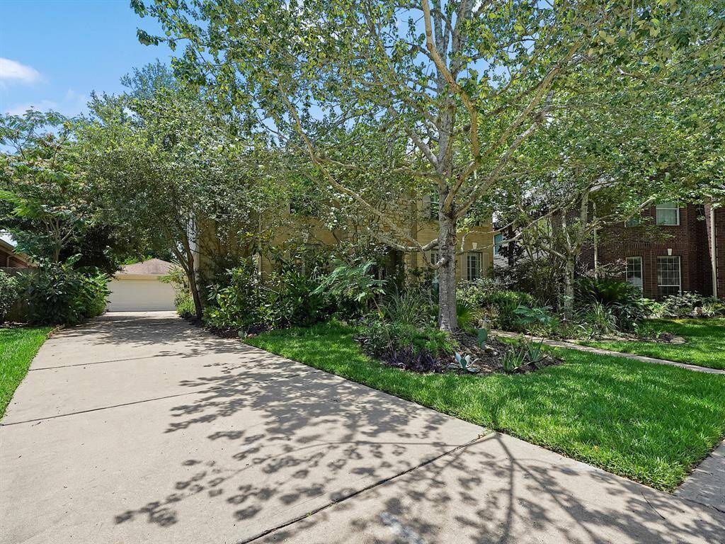 Detached garage allows ample parking in the extended driveway.