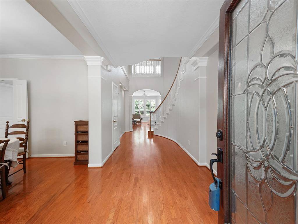 Freshly painted interiors create a bright and inviting ambiance throughout.Wood flooring flow throughout the main living areas and primary retreat.