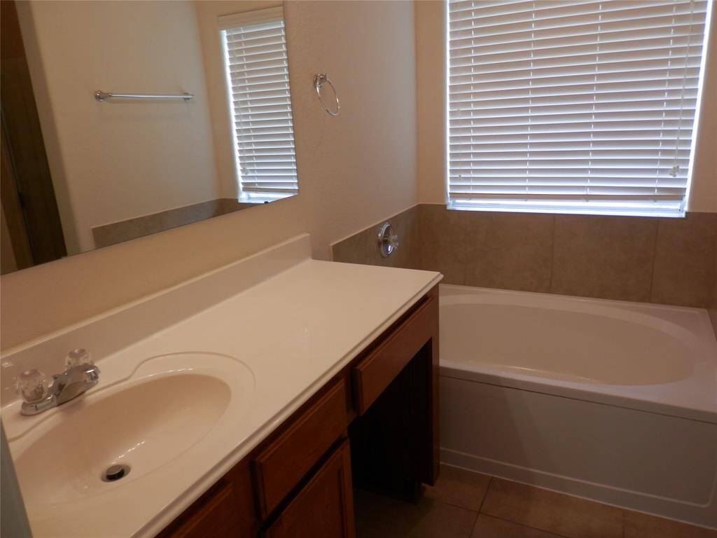 Primary bathroom features tub