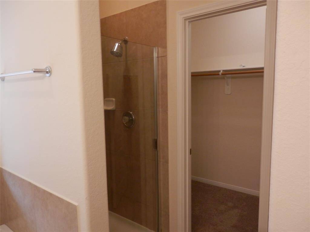 Primary bath also features walk-in shower