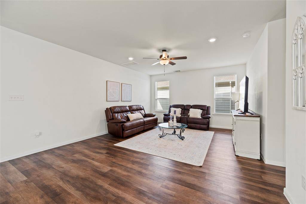 The living area offers ample space for large furniture and family gatherings.
