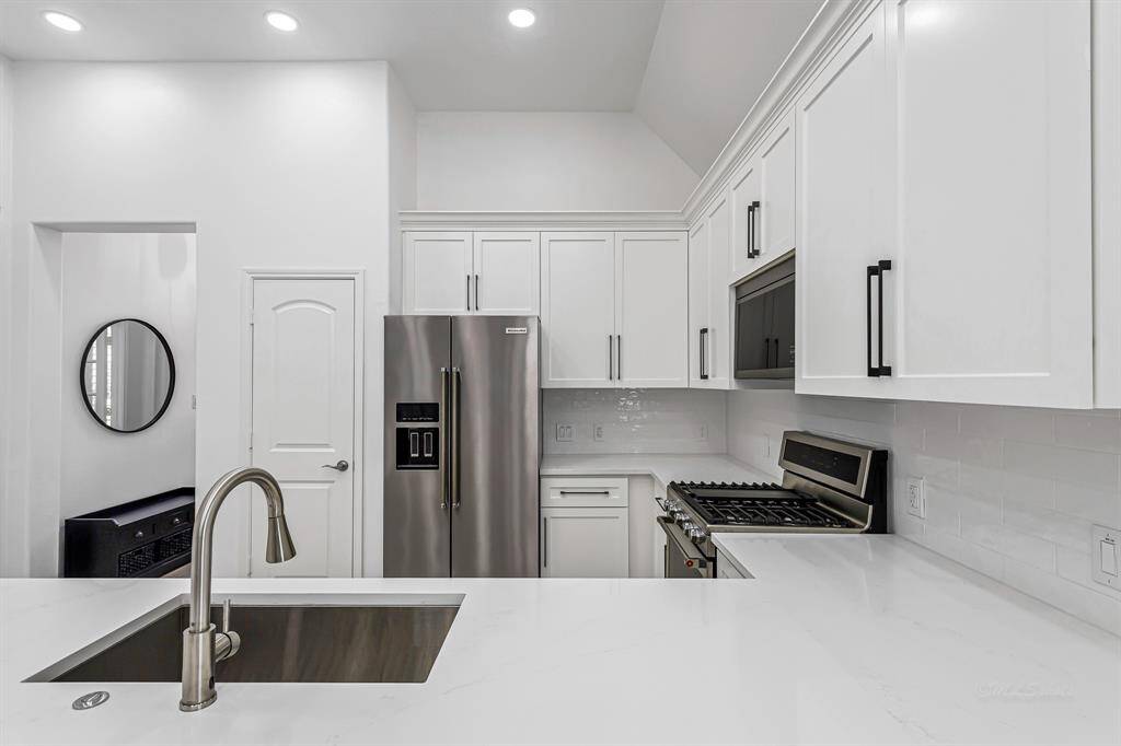 This kitchen shines with sleek stainless steel appliances that offer both style and performance, making everyday cooking a joy. The fresh interior paint throughout enhances the home's bright, airy feel and pairs beautifully with the clean lines and modern finishes for a crisp, move-in-ready look.