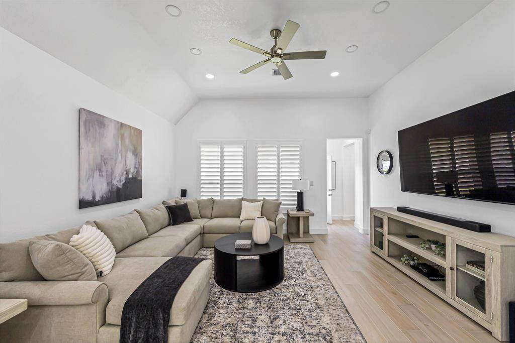 The family room is thoughtfully designed for both relaxation and gathering, featuring abundant lighting that brightens the space throughout the day.