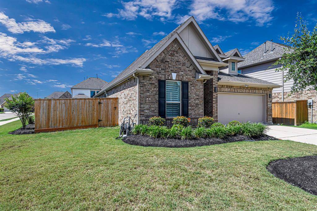 This beautifully maintained corner lot offers both space and privacy, thanks to the fully fenced yard and thoughtfully designed layout. The lush landscaping has been carefully cared for, providing vibrant curb appeal and a welcoming feel from every angle.