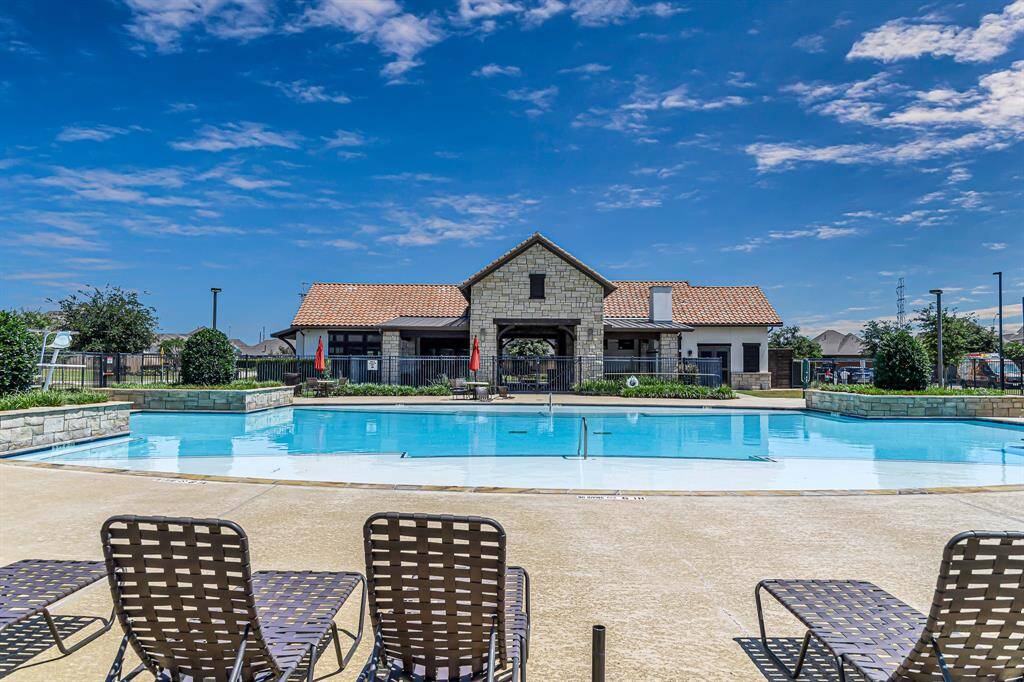 Welcome to the heart of the community—The Lakes of Bella Terra West Recreation Center, conveniently located at 24525 Afamia Dr. Enjoy resort-style amenities including a sparkling pool, modern gym, fun splashpad, playground, and a cozy outdoor lounge area with a fireplace—perfect for relaxing or entertaining all year round!