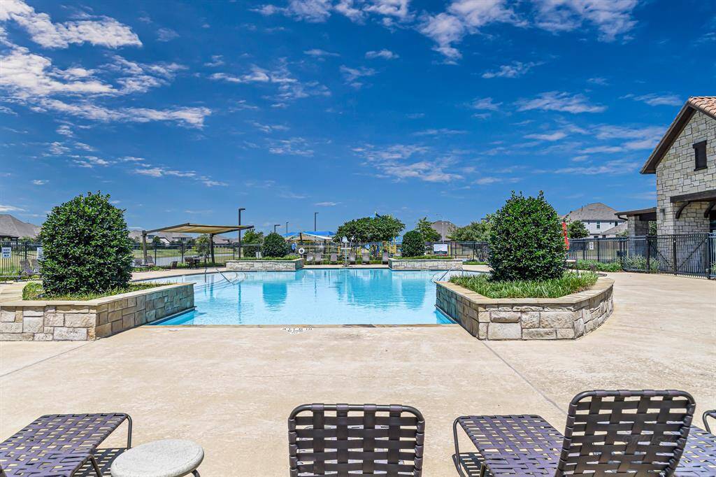 Enjoy a refreshing dip in the sparkling community pool—perfect for cooling off on a warm day, getting in a few laps, or simply lounging poolside with neighbors and friends. It's just one of the many ways life feels like a vacation in Lakes of Bella Terra West!