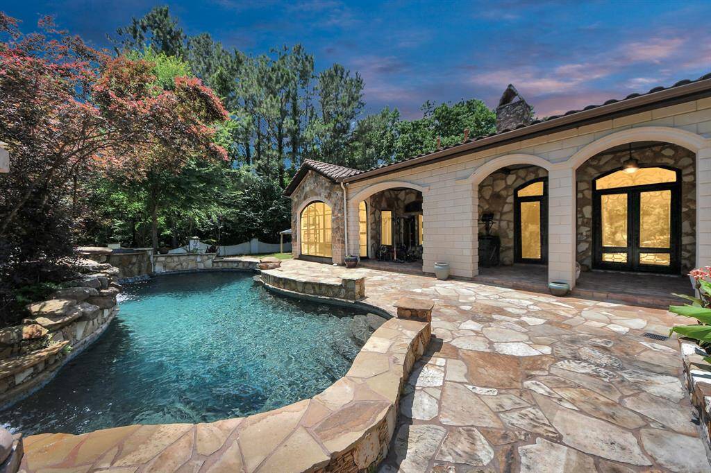Dive into luxury with this stunning custom-designed pool, offering a serene oasis perfect for relaxation and entertaining.